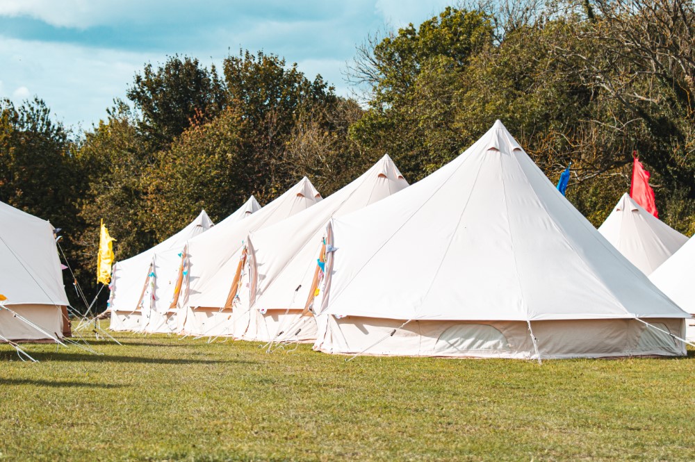 Stretch tent at wedding with pool in foreground